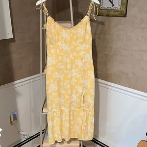 Yellow and white floral dress slit on the side